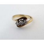 A 9ct gold ring set with trio of diamonds CONDITION: Please Note - we do not make