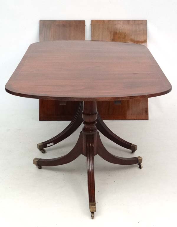 A 20thC mahogany Regency twin pedestal 2 leaf extending dining table 37" wide x 97" long - Image 2 of 3