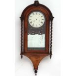 Clock : a 19 thC Rosewood cased arch topped wall clock, striking on a gong, with an 8 day movement ,