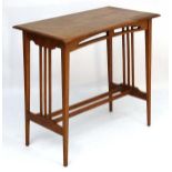Arts and Crafts : A 19thC satin walnut occasional table.