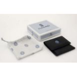A Lladro collectors society small black leather miniature wallet / coin purse having ceramic Lladro