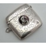 A silver plate vesta case with later applied enamel cabachon depicting a boxer dog