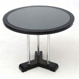 Art Deco : a chrome three legged circular coffee table with inset glass top ,