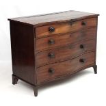 Manner of Gillows : A serpentine fronted mahogany chest of drawers comprising 4 graduate long