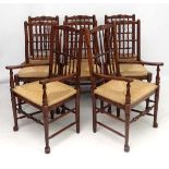 A set of 8 (6+2) oak spindle back chairs with envelope rush seats .