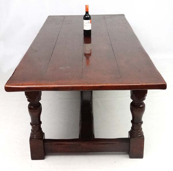 A large oak 4-plank dining table in the 17thC style Refectory table with baluster turned legs and - Image 5 of 7