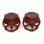 Chinese : a pair of red lacquer octagonal pot stands with polychromed images to top and decorated