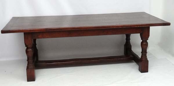 A large oak 4-plank dining table in the 17thC style Refectory table with baluster turned legs and