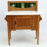 An Art Nouveau blonde oak marble topped and tile back washstand 35" wide x 16 3/4" deep