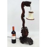 Chinese : a Chinese hardwood Table lamp in the form of a rearing dragon on a cloud like base,