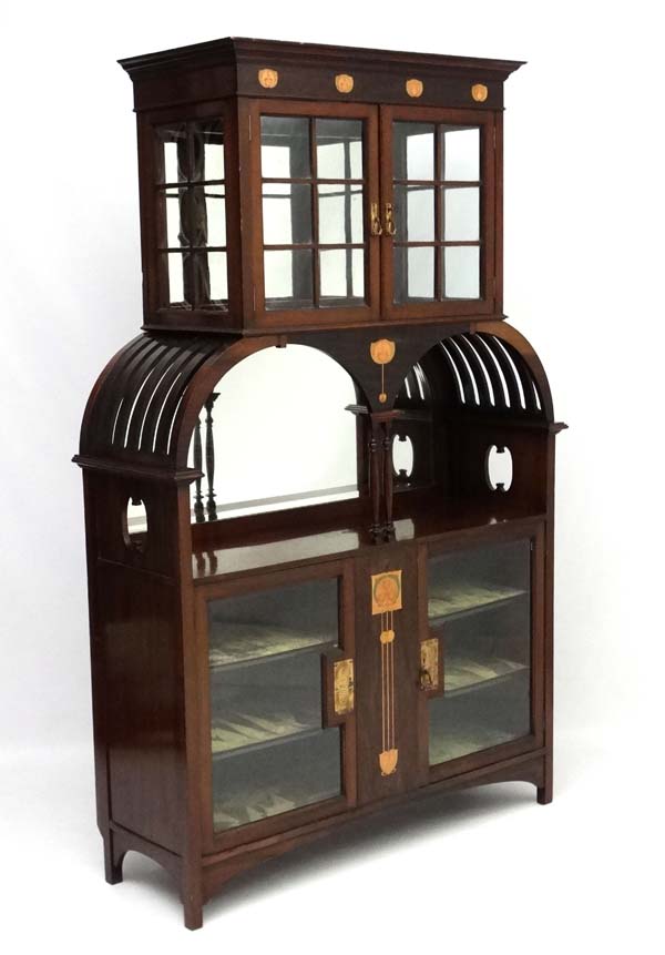 Art Nouveau : An inlaid mahogany cabinet with copper tulip wood and blonde wood inlay etc.