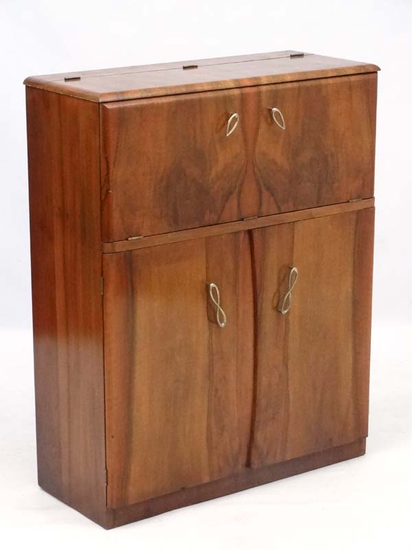 Art Deco : a 1930's walnut Cocktail Cabinet with fold down front revealing mirrored interior and