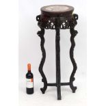 Chinese :A Chinese Rosewood marble ( grey with red veining ) topped jardinere stand with carved