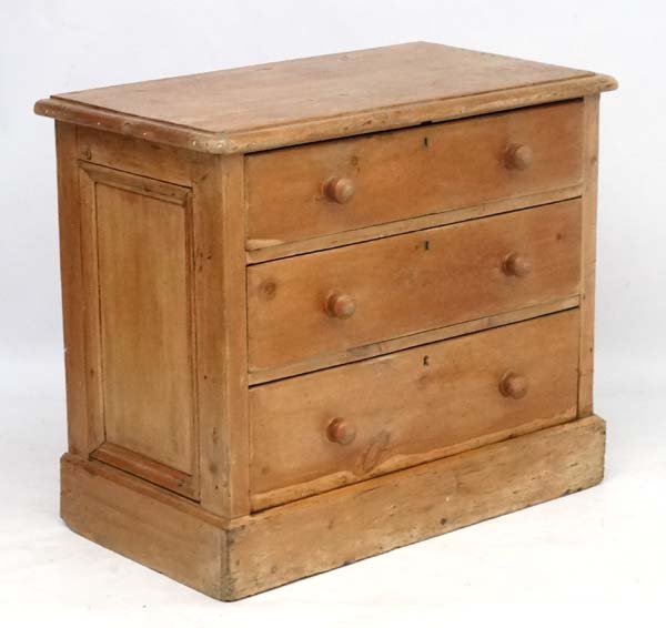 A 19thC pine chest of drawers comprising three graduated long drawers 35 1/2" wide x 19 3/4" deep x