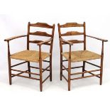 Arts and Crafts :A pair of Cotswold School Grimson designed 'Clissett ' chairs in the manner of a '