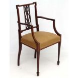 An Edwardian elbow chair with Kent style back approx 36" high CONDITION: Please