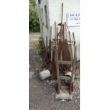 Large collection of old agricultural tools/ implements to include seed drill, yoke, spades,