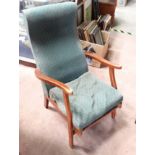 Green upholstered retro armchair CONDITION: Please Note - we do not make reference