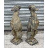 A pair of stone models of seated dogs (lurchers) CONDITION: Please Note - we do