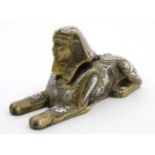 A Victorian desk top inkwell in the form of a sphinx profusely inlaid with copper and silver to the
