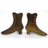 A pair of Victorian chimney adornments in the form of of brass and copper ladies shoes.