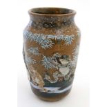 A Japanese Meiji style vase decorated in relief with frogs including one riding a bicycle on a