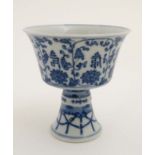 A Chinese blue and white stem cup ,