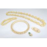 A 19thC Cantonese carved ivory bangle together with a bead necklace (2) CONDITION: