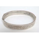 A silver bracelet of bangle form hallmarked Birmingham 1956 maker Joseph Gloster Ltd.