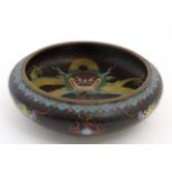 A signed cloisonne gilt metal and enamel bowl with image of 5 toed dragon with four character mark