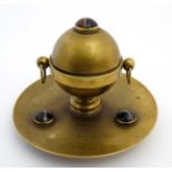 A Victorian brass inkstand decorated with banded agate cabochon and hinged orb style inkwell within.