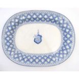 A large Spode blue and white meat plate, having armorial to centre and stylised foliate border,