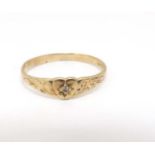 A child's 10k gold ring set with central diamond CONDITION: Please Note - we do