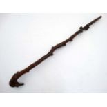 A 19thC root stock walking stick.