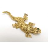 A 14k gold brooch formed as a lizard by H B AVAKOFF 1 ¾” long CONDITION: Please
