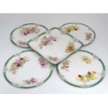 A set of four 'Royal Doulton Plates and a sweet meat dish in the ''orchid '' pattern.