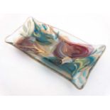 A glass dish with hand painted turquoise,