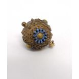 A gilt metal sphere formed pendant with enamel decoration.