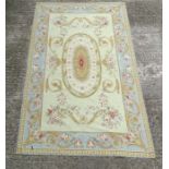 Carpet / Rug: an Aubusson woollen carpet in light sage ground with light blue border,