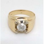 A 14k gold ring set with central diamond solitaire CONDITION: Please Note - we do