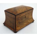 A Victorian burr walnut cross banded concave 2 division tea caddy on squat bun feet.