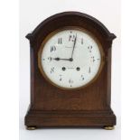 Finnegans Ltd Manchester : an 8 day bracket Clock striking on a coiled gong in a Mahogany stained