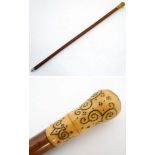 An 18thC walking stick with ivory piquet work handle,