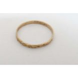 A childs yellow metal ring CONDITION: Please Note - we do not make reference to