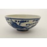 A Chinese blue and white porcelain bowl. Decorated with oriental birds in flight.