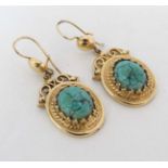 A pair of gilt metal drop earrings set with turquoise hardstone cabochon Approx 1 ½” long