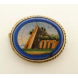 Micro Mosaic : A 9ct gold brooch set with oval micro mosaic scene to centre . Approx 1” wide.