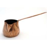 A small 19thC Copper milk pan with handle to one side and spout to front. 12'' long.