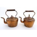 2 copper kettles, one with an acorn formed finial to lid.