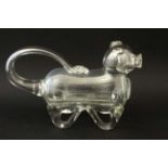 An early 20thC novelty glass claret jug / decanter in the form of a dog approx 10 1/2" long